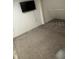 Cozy bedroom with carpeted flooring and a wall-mounted TV for relaxed living at 14545 Battenwood Dr, Spring Hill, FL 34610