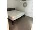 A bedroom with a large bed, a window with blinds and carpeted floors at 14545 Battenwood Dr, Spring Hill, FL 34610