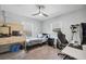 Bright bedroom featuring carpet flooring, a ceiling fan, plenty of natural light and a workspace at 14545 Battenwood Dr, Spring Hill, FL 34610