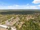 Overhead shot of a charming neighborhood with tree-lined streets and well-spaced homes at 14545 Battenwood Dr, Spring Hill, FL 34610