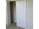 Closet with bifold doors and wire shelving, providing practical storage solutions for an organized space at 1514 Citrine Trl, Tarpon Springs, FL 34689