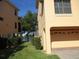 Spacious two car garage with a large side yard, room for a small garden at 1514 Citrine Trl, Tarpon Springs, FL 34689