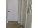 Hallway with tile floor, security system and doors, clean and well maintained at 1514 Citrine Trl, Tarpon Springs, FL 34689