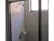 The tile shower includes decorative trim, a soap dish, and adjustable shower head at 1514 Citrine Trl, Tarpon Springs, FL 34689