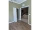 Spacious living room with hardwood floors and an open doorway at 21008 Sunpoint Way # 204, Lutz, FL 33558