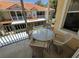 Relaxing patio with outdoor seating and views of the surrounding neighborhood at 21008 Sunpoint Way # 204, Lutz, FL 33558