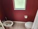 Cozy powder room with window, toilet, and bidet at 21008 Sunpoint Way # 204, Lutz, FL 33558