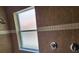 Tiled shower features window, two shower heads, and chrome fixtures at 21008 Sunpoint Way # 204, Lutz, FL 33558