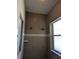 Tiled shower with two shower heads, soap dish, and window at 21008 Sunpoint Way # 204, Lutz, FL 33558