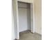 Walk-in bedroom closet with shelving provides ample storage space at 21041 Sunpoint Way # 202, Lutz, FL 33558