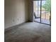 Bedroom leads to a patio with outside views perfect for relaxation and fresh air at 21041 Sunpoint Way # 202, Lutz, FL 33558