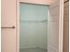 Open closet with built-in shelving offers functional storage solutions at 21041 Sunpoint Way # 202, Lutz, FL 33558