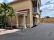 Inviting two-story home with lush landscaping, private balcony, and convenient garage access at 21041 Sunpoint Way # 202, Lutz, FL 33558
