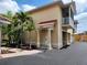 Attractive two-story home with a charming entrance, private balcony, and attached garage at 21041 Sunpoint Way # 202, Lutz, FL 33558