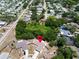 Aerial view of a home in a lush, green residential area at 2660 Orangewood Ct, Palm Harbor, FL 34684
