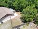 Aerial view of the backyard with a wooden fence and mature trees offering plenty of privacy at 2660 Orangewood Ct, Palm Harbor, FL 34684