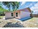 Large backyard area with concrete walkway at 2660 Orangewood Ct, Palm Harbor, FL 34684