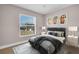 Bedroom features a large window, modern art, neutral walls, area rug and furnishings at 2660 Orangewood Ct, Palm Harbor, FL 34684