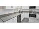 Renovated kitchen showcasing granite countertops and stainless steel appliances at 2660 Orangewood Ct, Palm Harbor, FL 34684