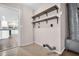Convenient laundry room featuring an open doorway, wooden shelves, and neutral paint at 2660 Orangewood Ct, Palm Harbor, FL 34684