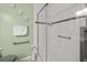 Bright bathroom featuring glass shower, modern fixtures, and grab bars for accessibility at 3340 Oleander Dr, Hernando Beach, FL 34607