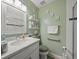 Well-lit bathroom with marble vanity, glass shower, and modern fixtures at 3340 Oleander Dr, Hernando Beach, FL 34607