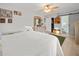Bright bedroom featuring natural light, ceiling fan, wood floors, closet, and neutral décor at 3340 Oleander Dr, Hernando Beach, FL 34607