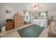 Bright bedroom featuring natural light, ceiling fan, wood floors, and neutral décor at 3340 Oleander Dr, Hernando Beach, FL 34607