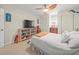 Bright bedroom with a ceiling fan, two closets, a bookcase, and a comfortable bed at 3340 Oleander Dr, Hernando Beach, FL 34607