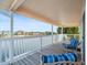 Serene covered deck with outdoor seating, offering picturesque waterfront views of the neighborhood at 3340 Oleander Dr, Hernando Beach, FL 34607