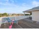 Inviting deck featuring comfortable lounge seating and views of the serene waterfront neighborhood at 3340 Oleander Dr, Hernando Beach, FL 34607