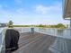 Open deck with a grill, chair and amazing views of the bay waters at 3340 Oleander Dr, Hernando Beach, FL 34607