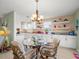 Eat-in kitchen offers a cozy dining area with seating for four and ample natural light at 3340 Oleander Dr, Hernando Beach, FL 34607