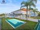 Waterfront property with a pool mock up and private dock offers an inviting facade at 3340 Oleander Dr, Hernando Beach, FL 34607