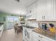 Kitchen featuring marble countertops, modern appliances, and an open-concept dining area at 3340 Oleander Dr, Hernando Beach, FL 34607