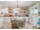 Eat-in kitchen featuring granite countertops, pendant lighting, and adjacent dining area at 3340 Oleander Dr, Hernando Beach, FL 34607