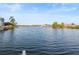 Expansive waterfront vista showcasing the calm waters and neighboring homes along the tranquil shoreline at 3340 Oleander Dr, Hernando Beach, FL 34607