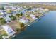 Breathtaking aerial view of a waterfront property featuring canal access and lush greenery at 3340 Oleander, Hernando Beach, FL 34607