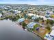 A waterfront lot with canal access, as depicted in a bird's eye view, surrounded by homes at 3340 Oleander, Hernando Beach, FL 34607