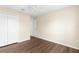Bright bedroom features hardwood floors, a closet, a ceiling fan, and neutral walls at 3410 Thistledown Ln, Land O Lakes, FL 34638