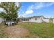 Spacious backyard featuring a trailer, wooden deck and potential for outdoor activities at 3638 Bigelow Dr, Holiday, FL 34691
