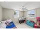 Bright bedroom with dual windows and a ceiling fan, perfect for a space at 3638 Bigelow Dr, Holiday, FL 34691