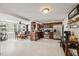 Well-lit kitchen featuring stainless steel appliances, wood cabinets, and adjacent dining area at 3638 Bigelow Dr, Holiday, FL 34691