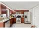 Well-equipped kitchen with stainless steel appliances, granite countertops, and ample cabinet space at 3638 Bigelow Dr, Holiday, FL 34691