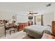 Bright bedroom with ceiling fan, large window, and neutral decor at 3638 Bigelow Dr, Holiday, FL 34691