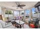 Relaxing sunroom with tiled floors and multiple windows, perfect for enjoying natural light at 3638 Bigelow Dr, Holiday, FL 34691