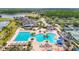 Aerial view of a community entrance with lush landscaping and serene waterfront views at 4207 Fishermans Lake Dr, Lutz, FL 33558