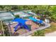 Aerial view of a community playground, tennis courts and other recreational facilities at 4207 Fishermans Lake Dr, Lutz, FL 33558