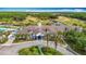 An aerial view of the community clubhouse featuring a beautiful golf course and surrounding landscape at 4207 Fishermans Lake Dr, Lutz, FL 33558