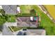 Aerial view of the home showing the screened in lanai and well-manicured yard at 4207 Fishermans Lake Dr, Lutz, FL 33558